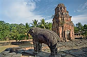 Bakong temple - ruined monolithic elephants mark the corners of the pyramid